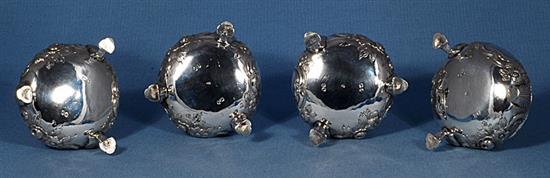 A set of four Victorian embossed silver table salts, by Roberts & Briggs, height 47mm, weight 12.8oz/401grms.